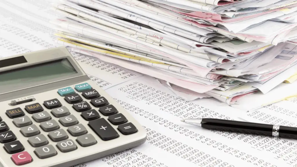 A person looking frustrated at a pile of disorganized papers, with a thought bubble showing complex equations, symbolizing common financial chaos.