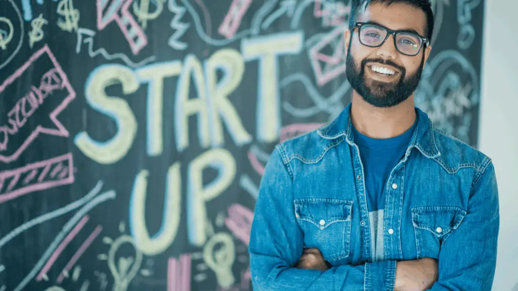 Tech startup founders reviewing financial dashboard with CPA advisor