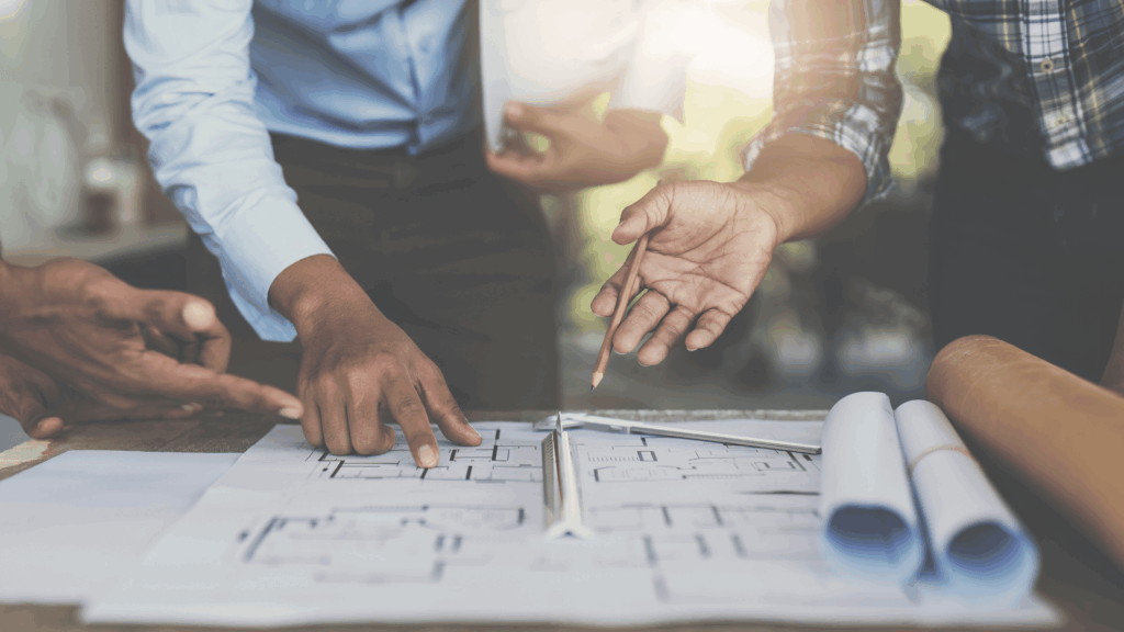Accountant for architects reviewing project financials with team