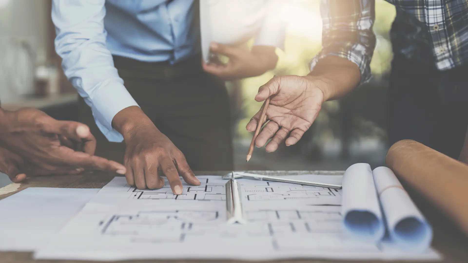 Accountant for architects reviewing project financials with team