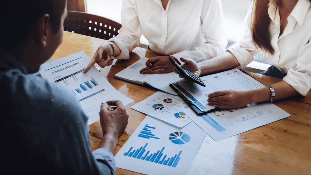 Small business owner reviewing financial reports with Milestone CPA